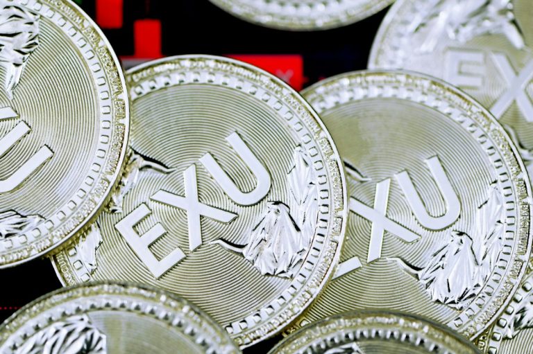 silver and gold round coin