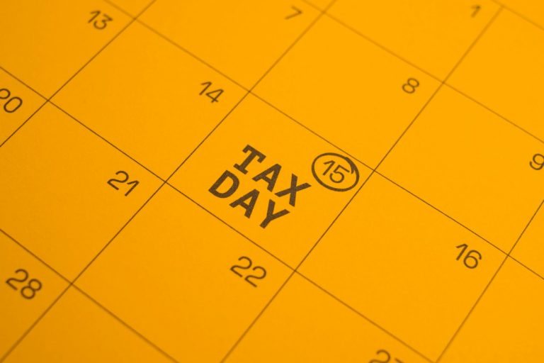Calendar shows "tax day" circled on the 15th