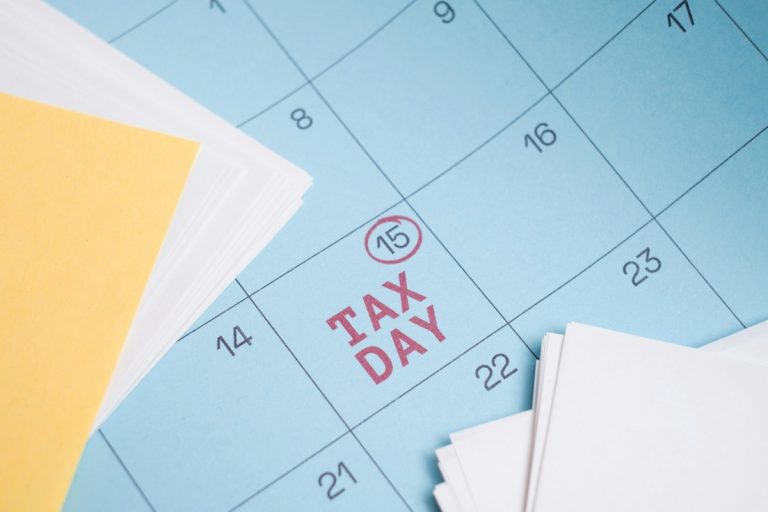 Calendar marked with "tax day" on the 15th