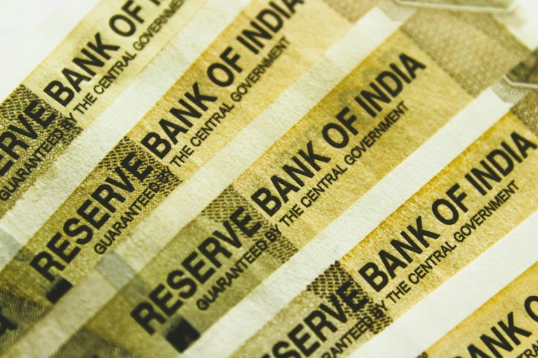 A stack of banknotes representing investment capital and tax planning