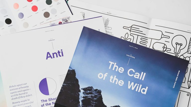 A collection of materials and books laid out on a table