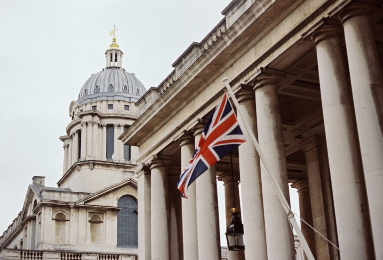 A British flag flying proudly outside an office building in the UK