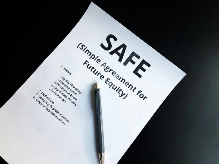 A fountain pen resting on business documents