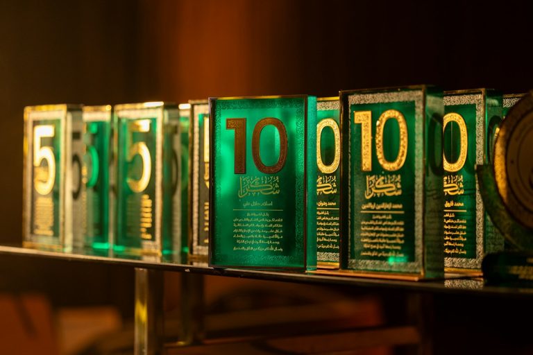 Row of green awards with numbers five and ten